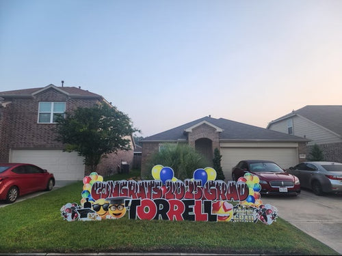 Custom Graduation yard sign rental in Katy TX with large colorful letters and lawn display