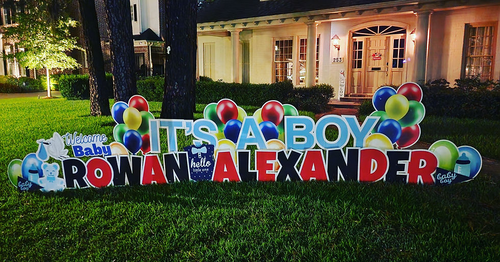 Custom baby shower announcements in Houston TX with large colorful letters and lawn display